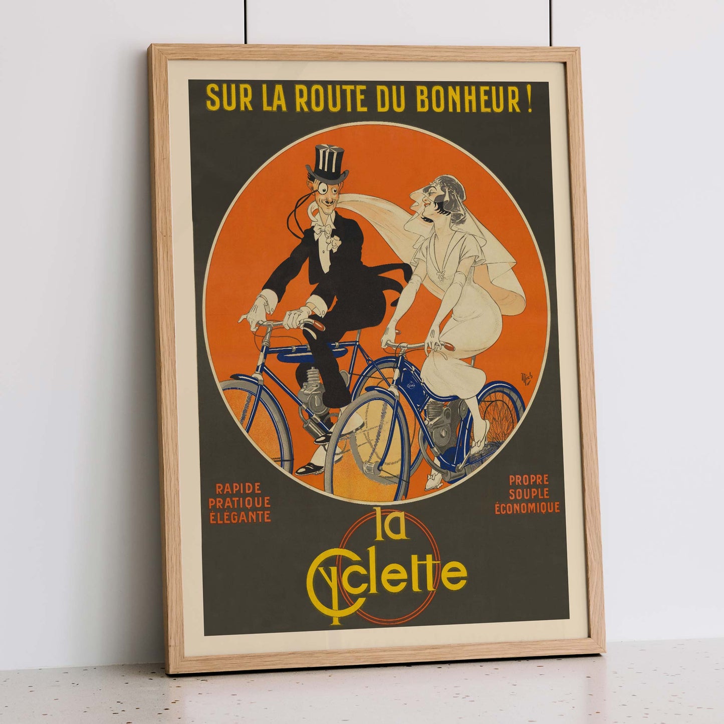 Michel Liebeaux Sur la route du bonheur vintage cycling poster with stylish couple riding blue bicycles against vivid orange circle, with wooden magnetic frame on white background