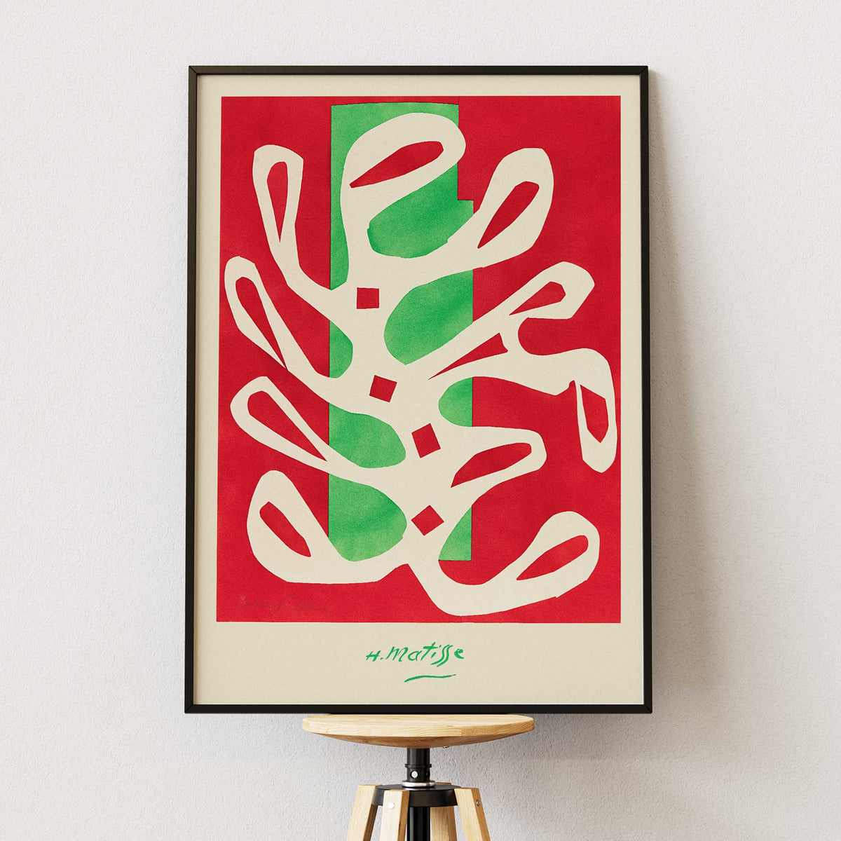 Henri Matisse White Alga on Red and Green Background poster with white seaweed cutout over red and green blocks, with wooden magnetic frame on white background
