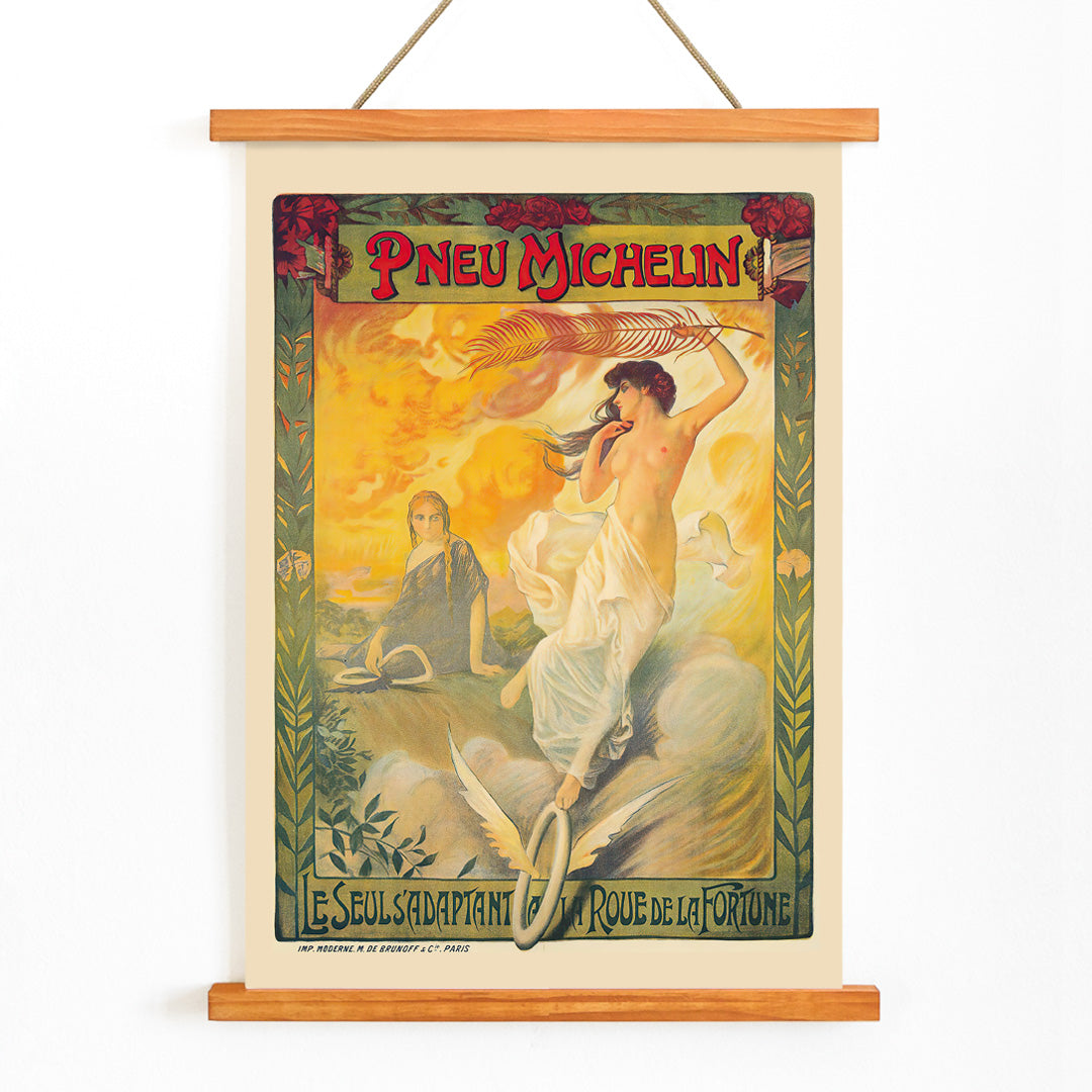 Vintage Michelin tire advertisement by Edouard Michelin featuring women artistic flourishes flowing fabric palm leaf and winged tire Pneu Michelin poster artwork, with wooden magnetic frame on white background