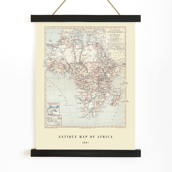 Antique map of Africa by Institute of Liepzig showing exploration routes geographic features and country names wall art poster, with wooden magnetic frame on white background