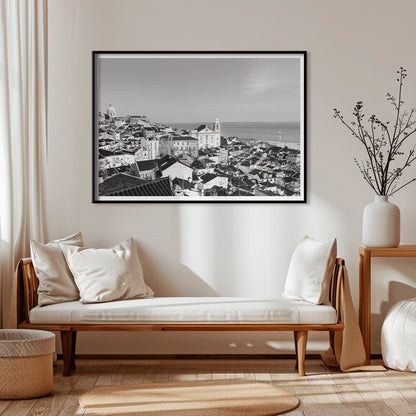 Black and white landscape poster of Alfama Lisbon Old City with traditional buildings and Tagus River by artist Alfama Lisbon, framed and displayed in home decor