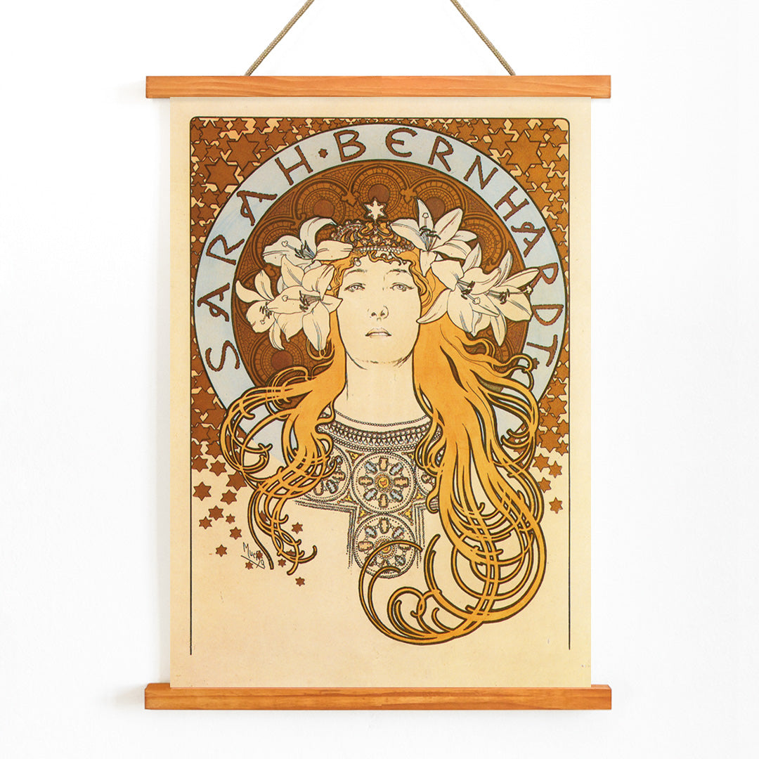 Art Nouveau poster of Sarah Bernhardt with flowing hair floral crown and lilies by Alphonse Mucha from La Plume, with wooden magnetic frame on white background