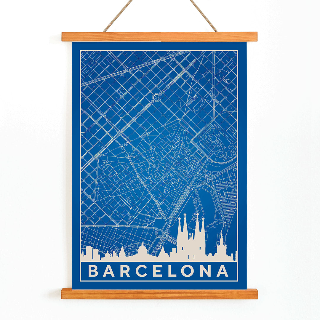 Minimalist blue and white map of Barcelona by Moryarty featuring iconic landmarks street layout and skyline poster titled Minimalist Map of Barcelona 2, with wooden magnetic frame on white background