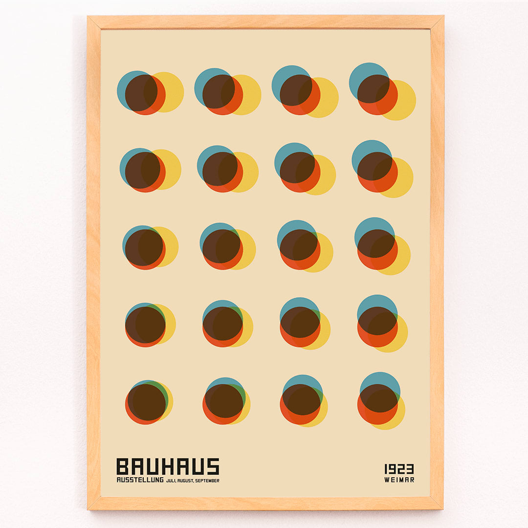 Bauhaus Poster 7 inspired by the 1923 Weimar Exhibition featuring colorful geometric overlapping circles in blue red yellow and brown tones, framed and displayed in modern living room decor