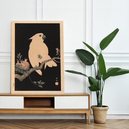 White cockatoo perched on a branch with pomegranate artwork by Ohara Koson poster, framed and displayed in home decor