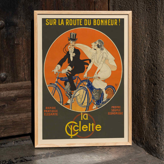 Michel Liebeaux Sur la route du bonheur vintage cycling poster with stylish couple riding blue bicycles against vivid orange circle, framed and displayed in home decor
