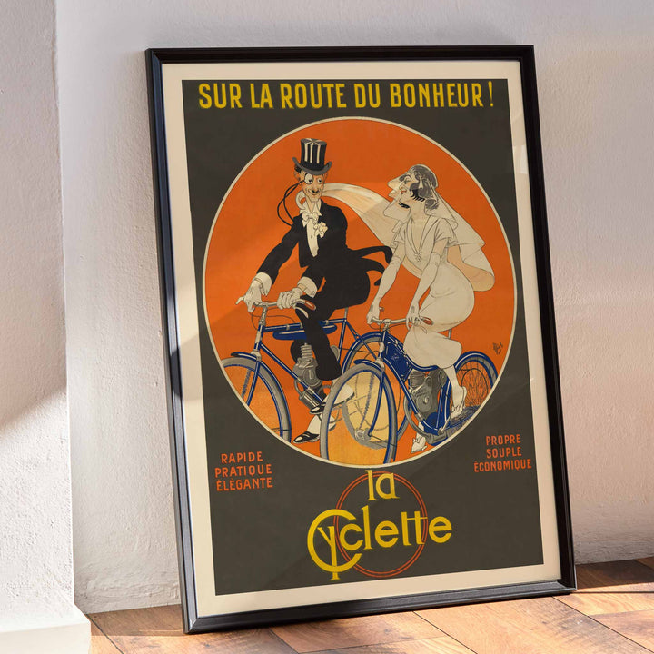 Michel Liebeaux Sur la route du bonheur vintage cycling poster with stylish couple riding blue bicycles against vivid orange circle, framed and displayed in modern living room decor