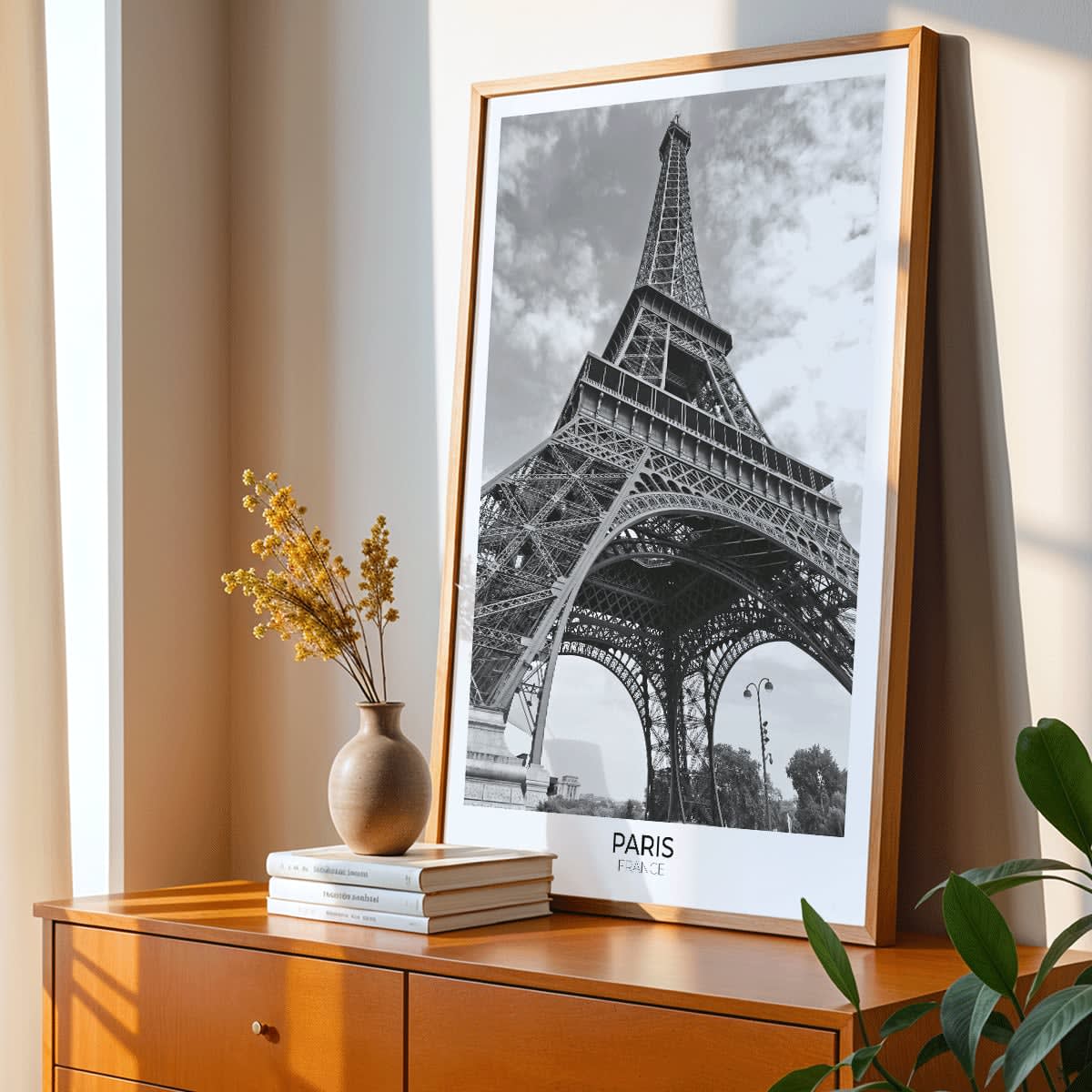 Black and white picture of the Eiffel Tower in Paris featuring its intricate structure by artist poster titled Tour Eiffel Black and White, framed and displayed in modern living room decor