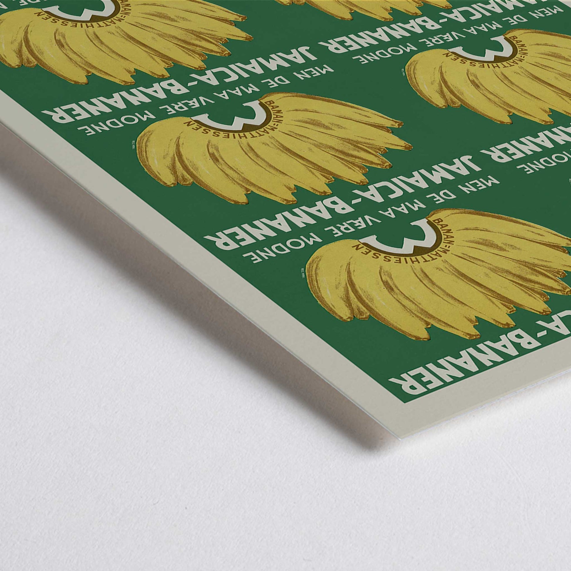 Closeup detail of Jamaica Bananas poster with repeated ripe yellow banana bunches on a deep green vintage advertising design