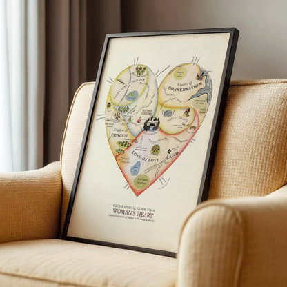 Heart shaped map illustration and poster Geographical Guide to a Womans Heart by Jo Lowery whimsical map of emotions in the shape of a heart, framed and displayed in modern living room decor