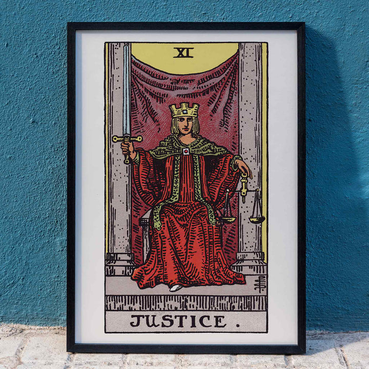 Pamela Colman Smith Justice tarot poster crowned figure in red robes with scales and sword, framed and displayed in home decor