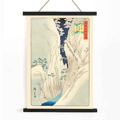 Snowy mountain gorge with river travelers and trees in The Kiso Gorge in Snow Shinano Province by Hiroshige II Japanese artwork poster, with wooden magnetic frame on white background