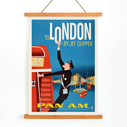 Vintage Pan Am Airlines poster artwork featuring a flight attendant and double decker bus promoting travel to London by Jet Clipper, with wooden magnetic frame on white background