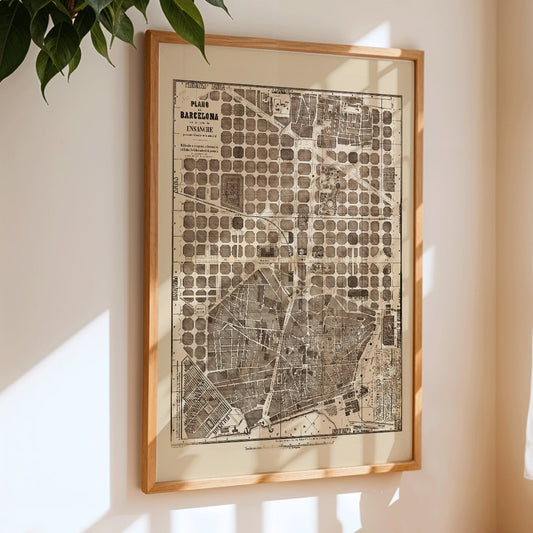 Detailed vintage map of Barcelona poster artwork featuring a city map layout with illustrated streets and blocks, framed and displayed in home decor