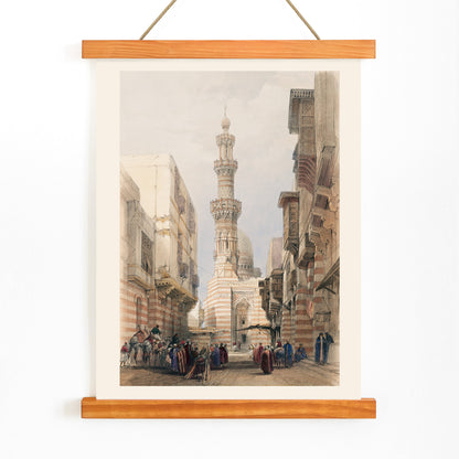Bullack Cairo cityscape illustration by David Roberts featuring people in traditional clothing and historic architecture, with wooden magnetic frame on white background