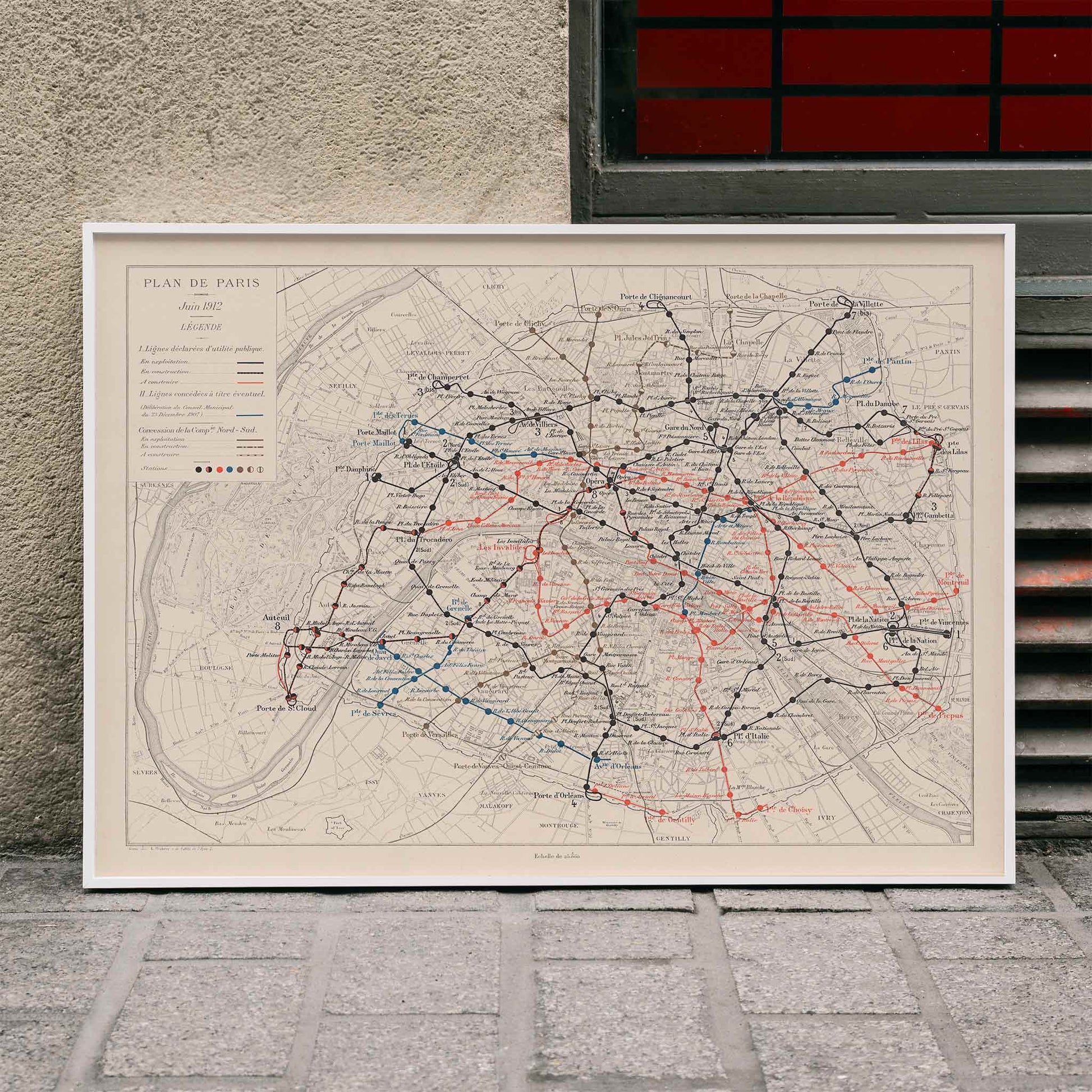 Louis Wuhrer Paris metro map poster vintage city plan with black and red rail lines, framed and displayed in home decor