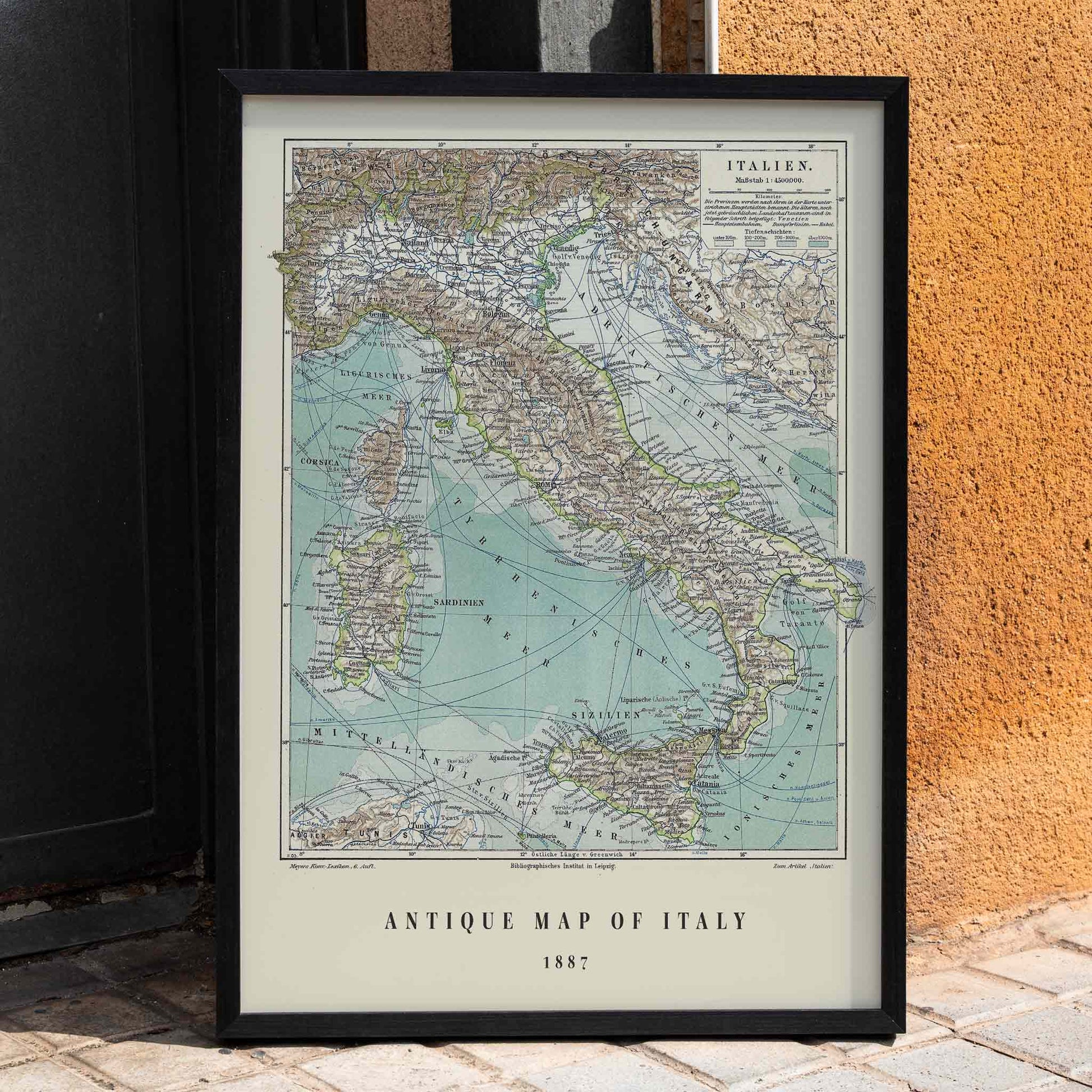 Colorful historical map of Italy by Institute of Liepzig German antique artwork with detailed geographical features, framed and displayed in home decor