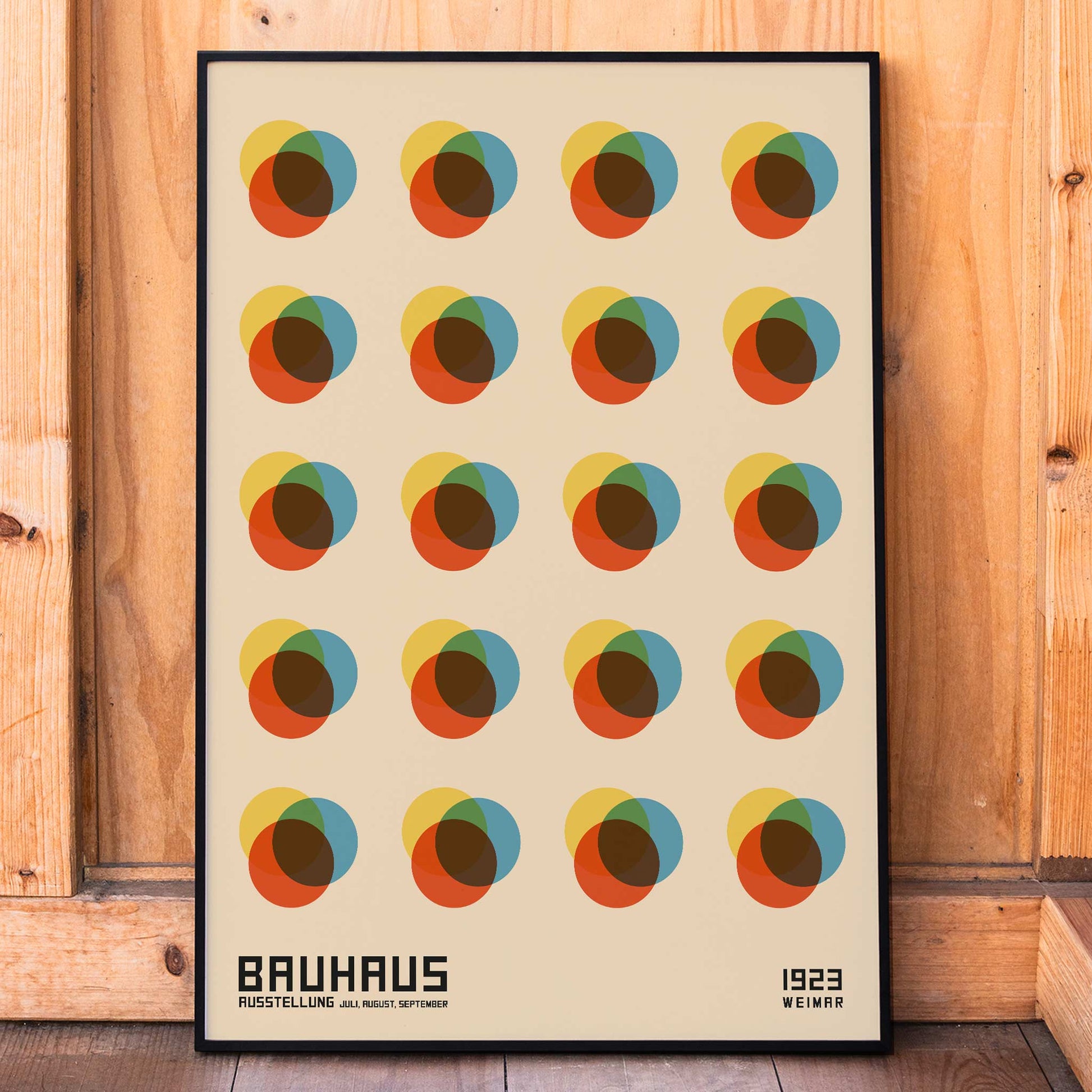 Bauhaus Poster 8 Inspired by the Weimar Exhibition with abstract colorful overlapping circles in a geometric grid pattern, framed and displayed in home decor