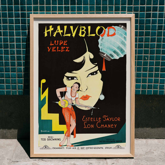 Poster artwork for Where East is East featuring Lupe Velez Estelle Taylor Lon Chaney and illustration by Eric Rohman with Lupe Velez playing a string instrument, framed and displayed in home decor