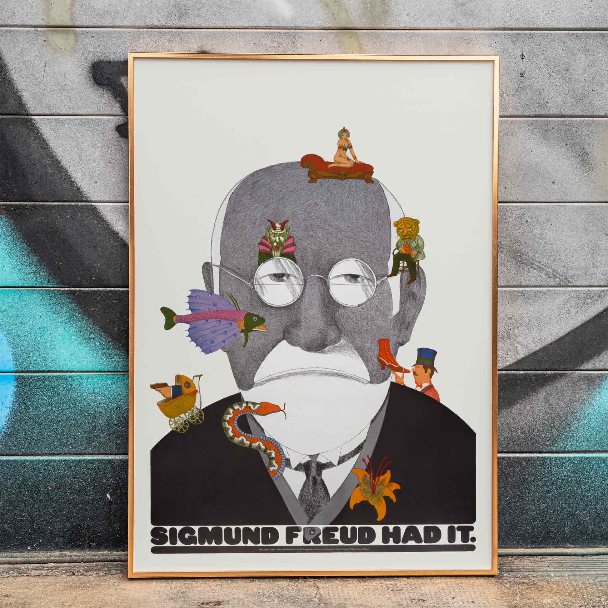 Surreal Sigmund Freud portrait and poster with colorful whimsical illustrations by Seymour Chwast, framed and displayed in home decor