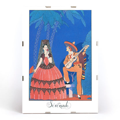 Serenade by George Barbier man playing guitar for woman in elegant or Spanish dress under palm trees romantic art poster, framed and displayed in modern living room decor