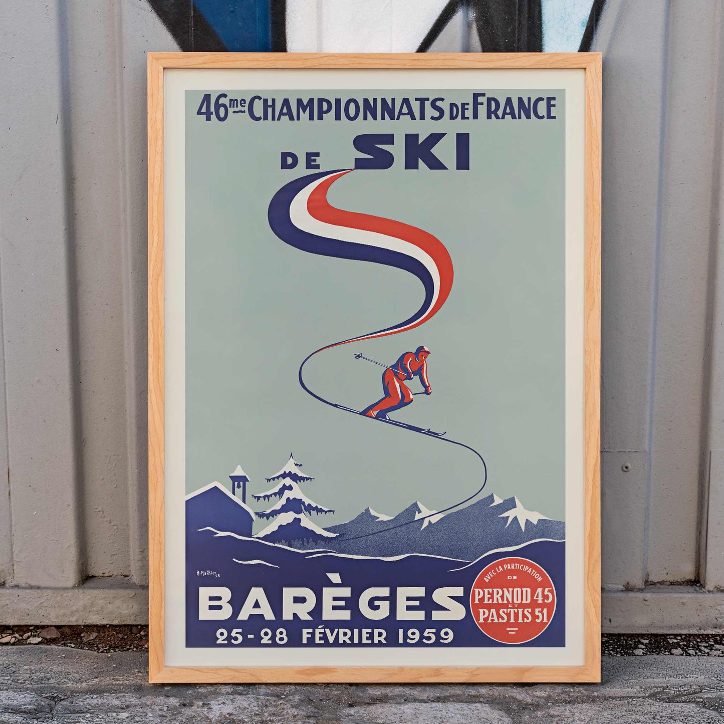 H. Mathieu French Ski Championships poster for Barèges with alpine skier, blue slopes, red and white ribbon graphics, snowy mountains, framed and displayed in home decor