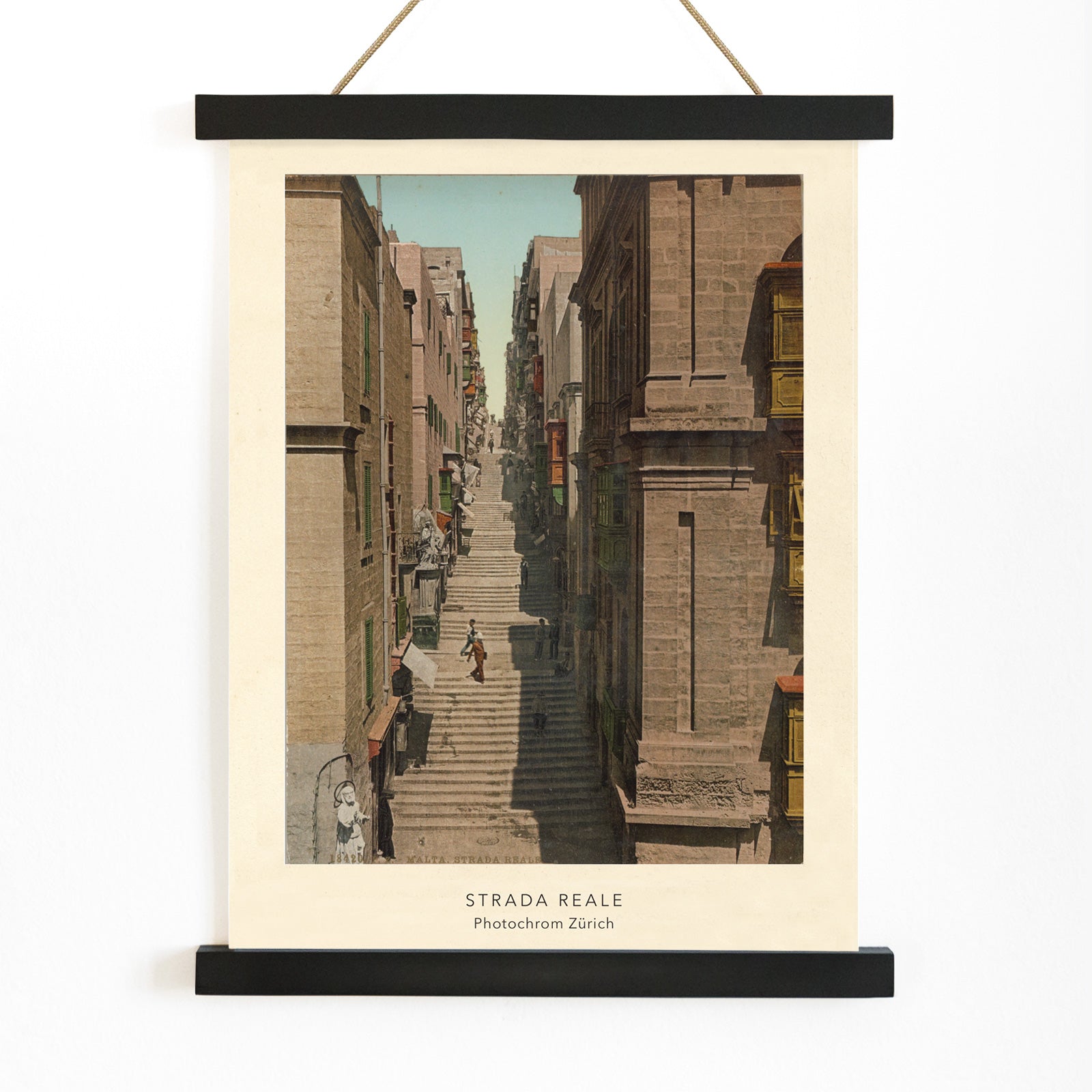 Steep stone staircase and historic street scene with people in Valletta Strada Reale by Photochrom Zurich, with wooden magnetic frame on white background