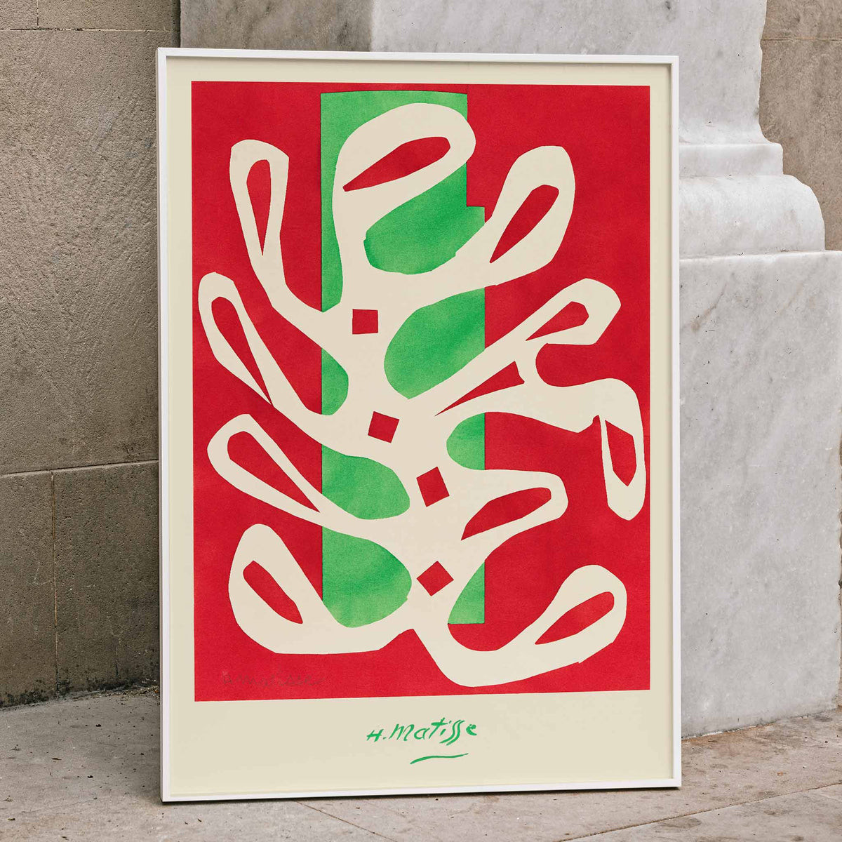 Henri Matisse White Alga on Red and Green Background poster with white seaweed cutout over red and green blocks, framed and displayed in home decor