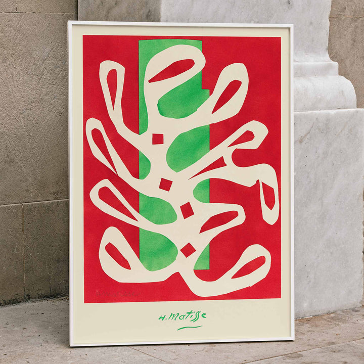 Henri Matisse White Alga on Red and Green Background poster with white seaweed cutout over red and green blocks, framed and displayed in home decor