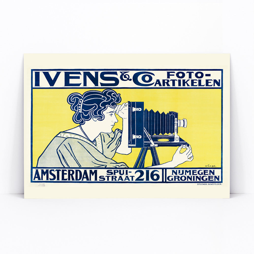 Art nouveau poster of woman using vintage camera at Ivens and Co Camera Shop by Johann Georg van Caspel, framed and displayed in modern living room decor