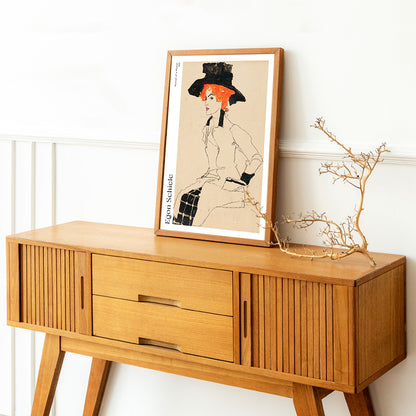 Portrait Of A Woman by Egon Schiele featuring an elegant woman with red or orange hair and a black hat poster, framed and displayed in home decor