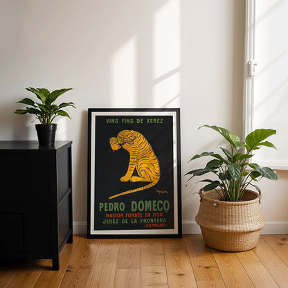 Leonetto Cappiello poster of a playful tiger on black background promoting Xerez Pedro Domeco wine, framed and displayed in modern living room decor